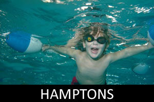 young boy swimming underwater in the hamptons