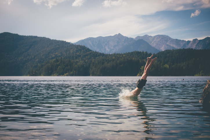 Man diving into a lake