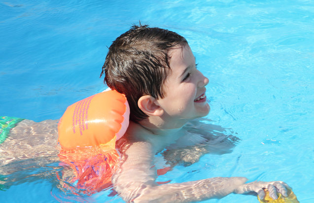young boy in the pool
