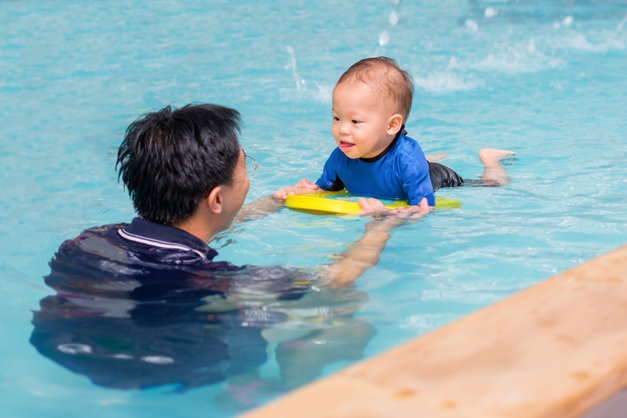 Asian Father take Cute little Asian 18 months / 1 year old toddler baby boy child to swimming class