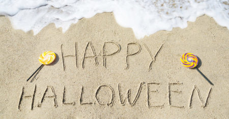 Happy Halloween Written In Sand