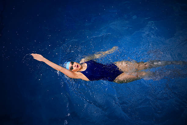 Young Woman Swimming Olympic Swimming Costume