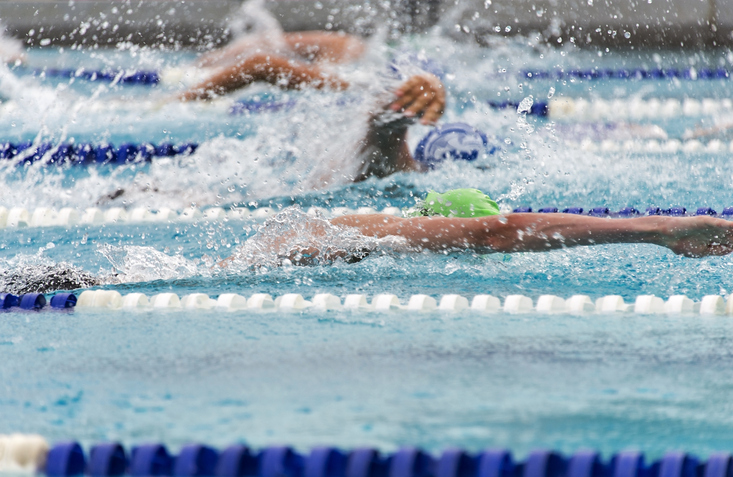 Swimmers racing at a swim meet