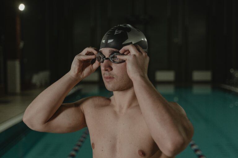 man putting on goggles